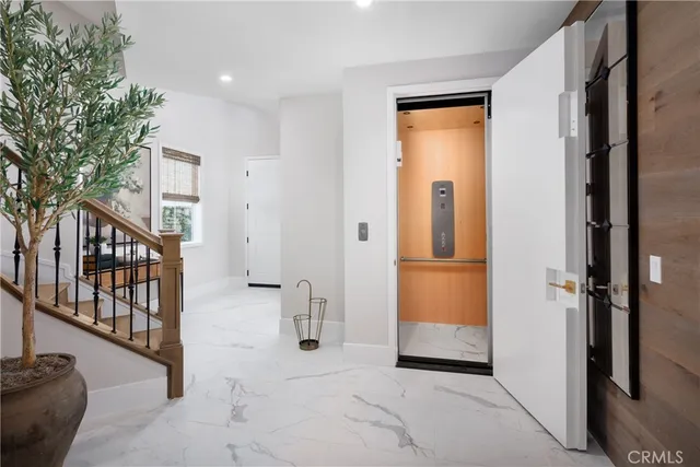 a view of a hallway with entryway door