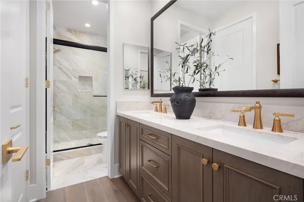 a kitchen with a refrigerator and white cabinets