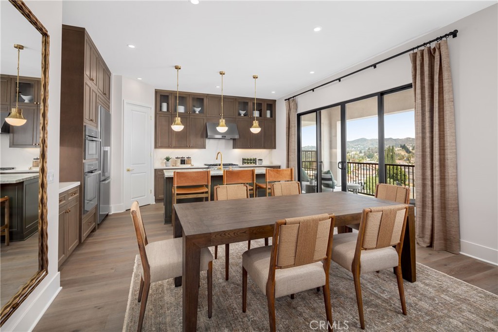 22085 Manarola Way Walnut, CA 91789 - Photo 10 of 20 a view of a dining room with furniture window and wooden floor