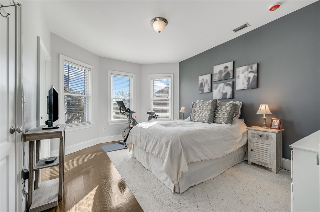 720 East 8th Street, Unit 2 Boston, MA 02127 - Photo 6 of 14 a living room with a bed furniture and a flat tv screen
