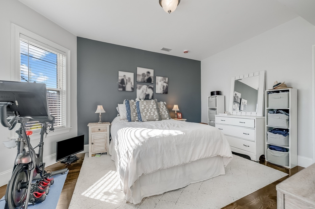 720 East 8th Street, Unit 2 Boston, MA 02127 - Photo 7 of 14 a bedroom with a bed and a flat screen tv