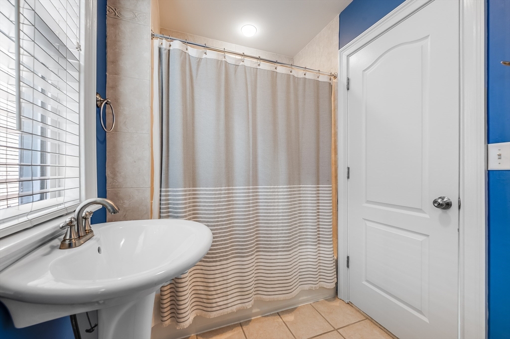 720 East 8th Street, Unit 2 Boston, MA 02127 - Photo 9 of 14 a bathroom with a sink and a mirror