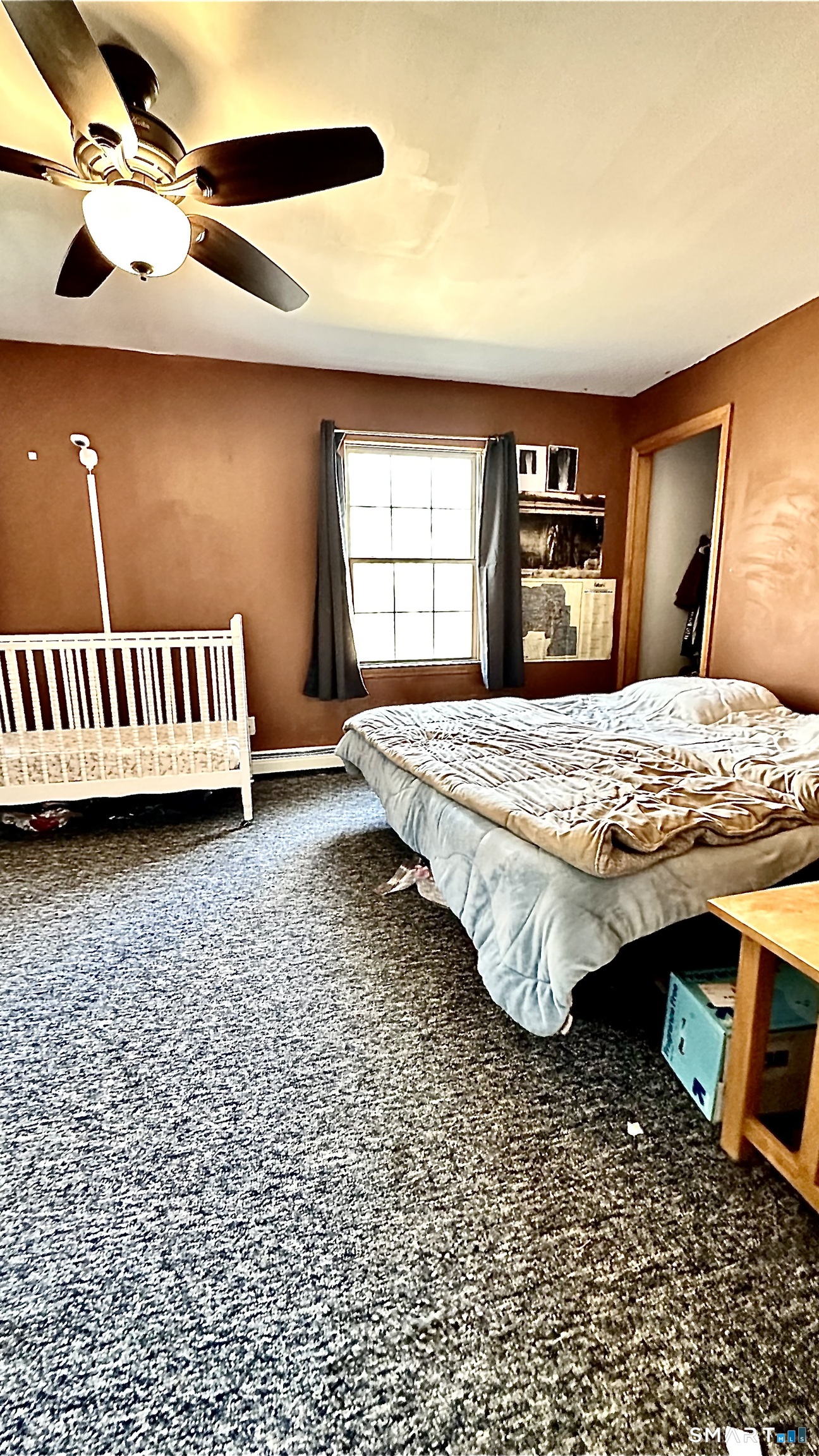 512 Brook Road Scotland, CT 06247 - Photo 13 of 22 a bed sitting in a room next to a window