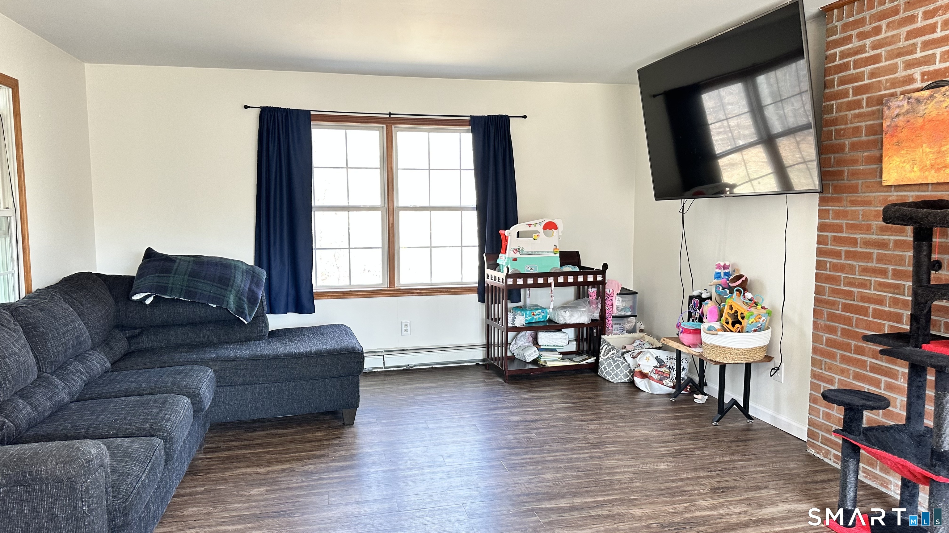512 Brook Road Scotland, CT 06247 - Photo 6 of 22 a living room with furniture and a window
