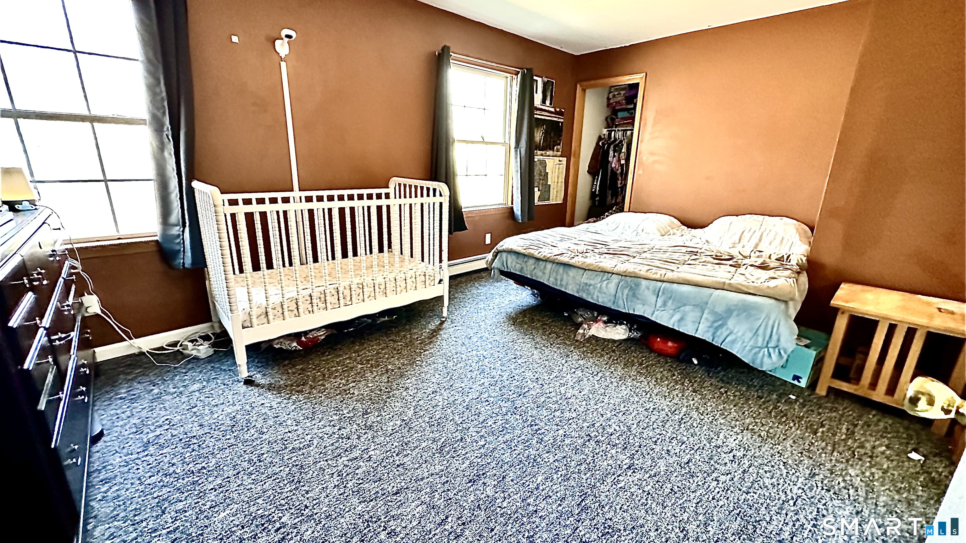 512 Brook Road Scotland, CT 06247 - Photo 7 of 22 a bedroom with a bed and wooden floor