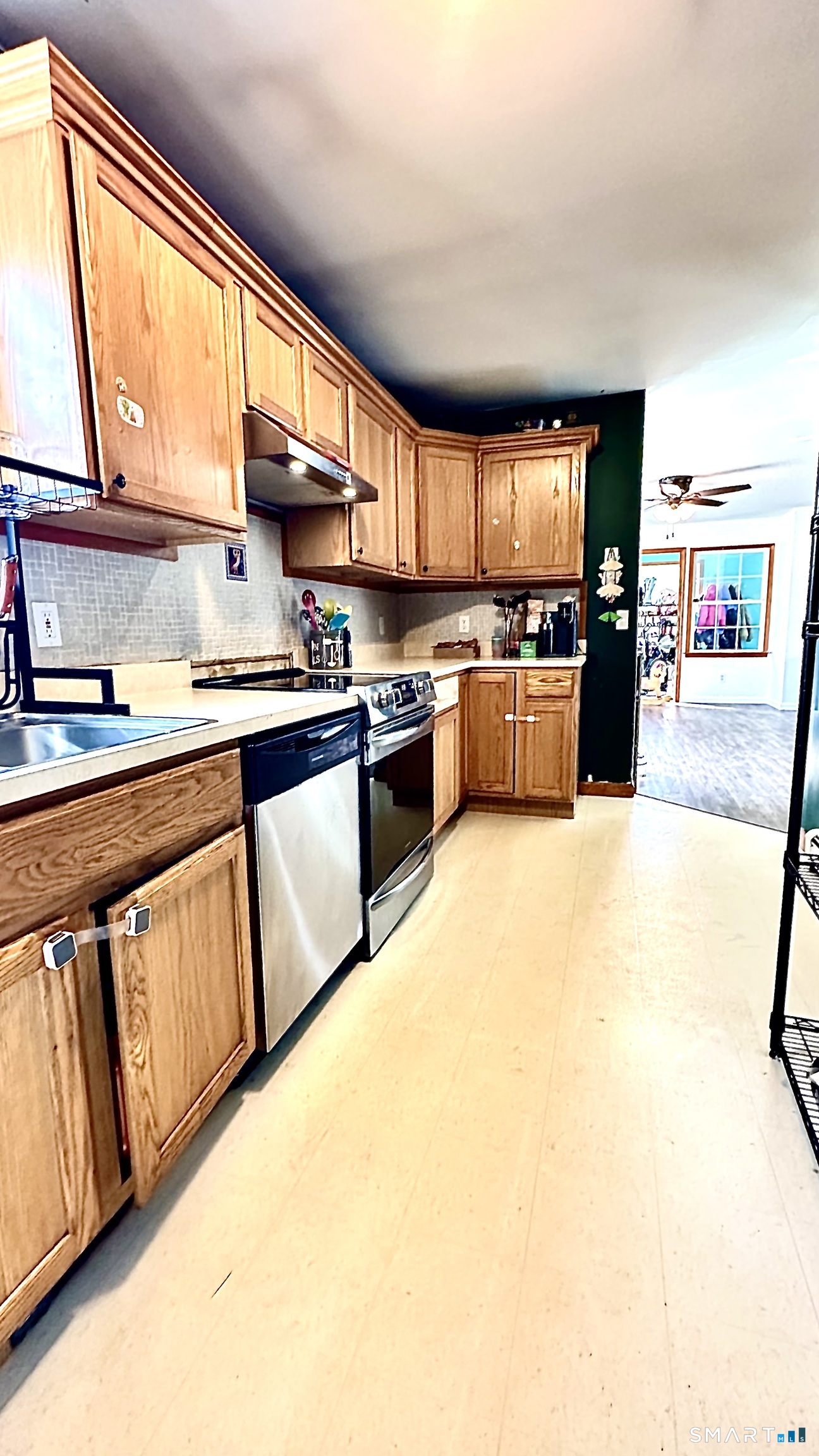 512 Brook Road Scotland, CT 06247 - Photo 8 of 22 a kitchen with stainless steel appliances granite countertop a stove a sink and a refrigerator