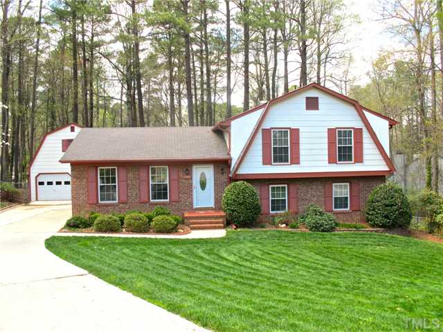 6509 Dew Drop Court Raleigh, NC 27613 - Photo 1 of 25 a front view of a house with a yard and trees