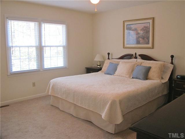 6509 Dew Drop Court Raleigh, NC 27613 - Photo 13 of 25 a bedroom with a bed and a window