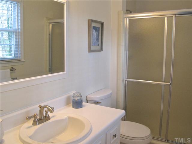 6509 Dew Drop Court Raleigh, NC 27613 - Photo 15 of 25 a bathroom with a sink toilet and shower