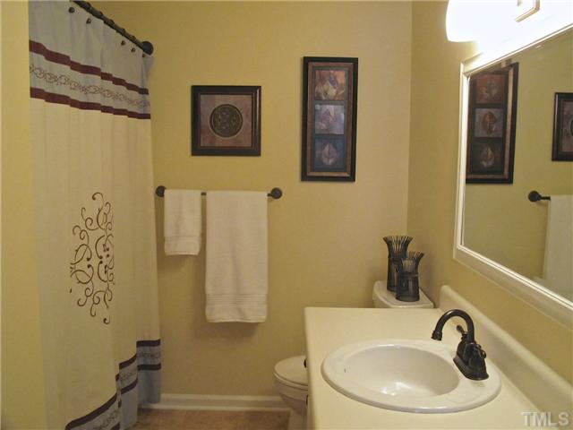 6509 Dew Drop Court Raleigh, NC 27613 - Photo 18 of 25 a bathroom with a sink and a toilet