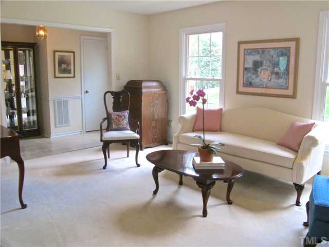 6509 Dew Drop Court Raleigh, NC 27613 - Photo 5 of 25 a living room with furniture a piano and a window