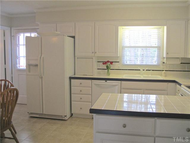 6509 Dew Drop Court Raleigh, NC 27613 - Photo 8 of 25 a kitchen with a sink and a window