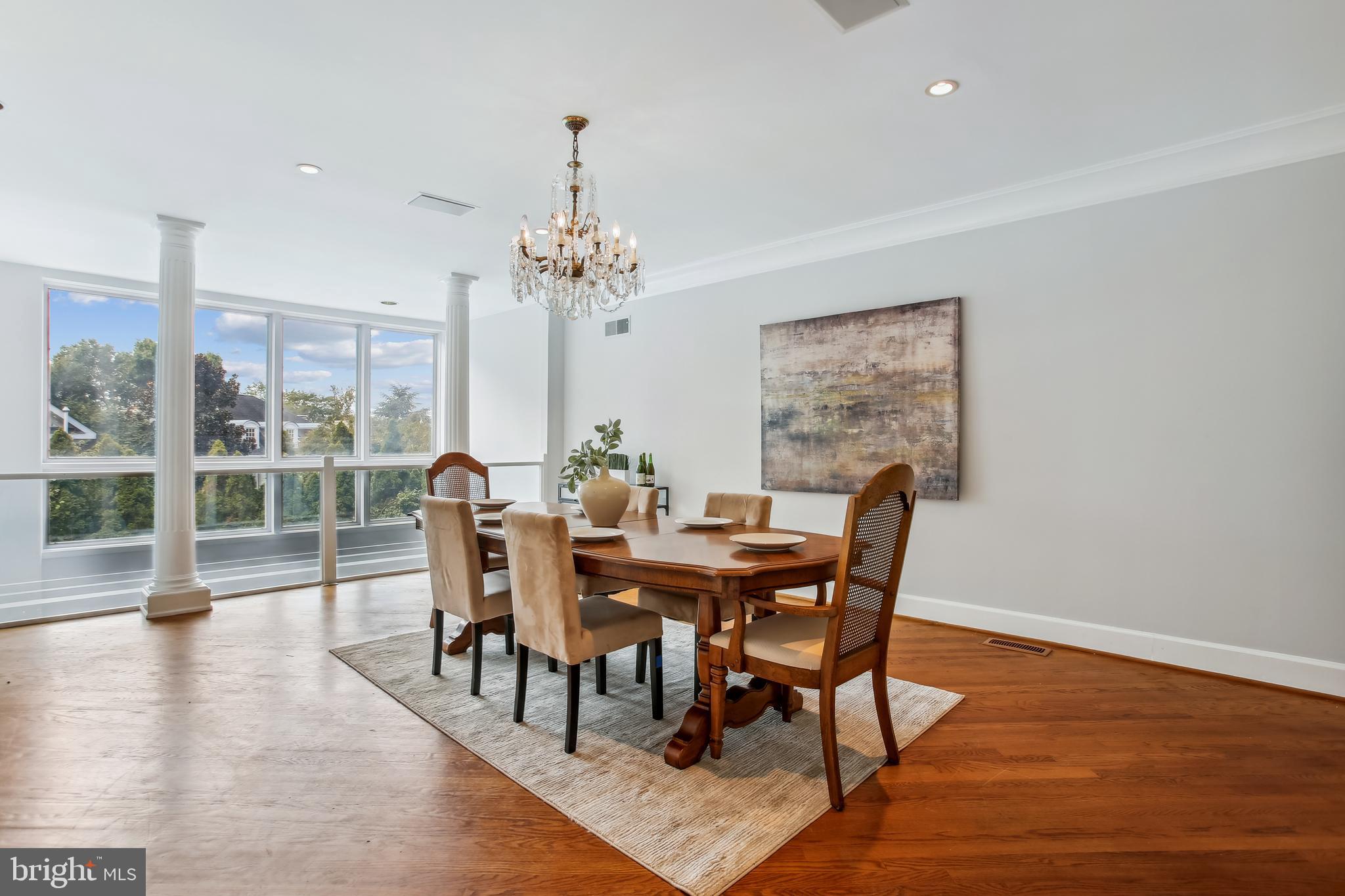 4516 Foxhall Crescent Northwest Washington, DC 20007 - Photo 6 of 30 a view of a dining room with furniture window and wooden floor