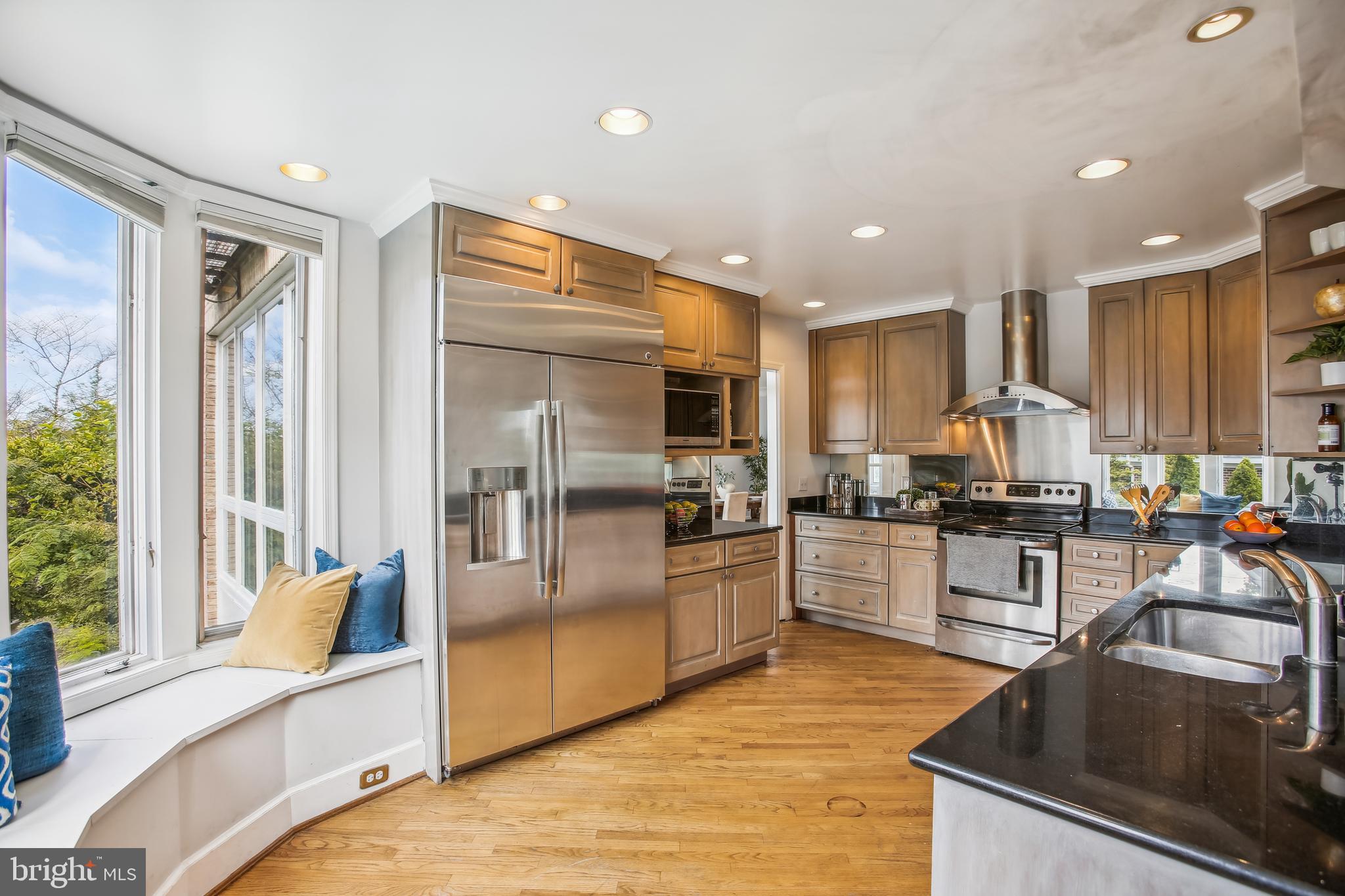 4516 Foxhall Crescent Northwest Washington, DC 20007 - Photo 8 of 30 a kitchen with stainless steel appliances granite countertop a sink stove and refrigerator
