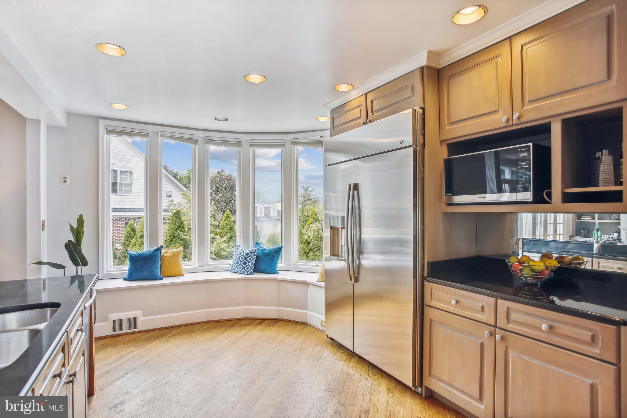 4516 Foxhall Crescent Northwest Washington, DC 20007 - Photo 9 of 30 a kitchen with stainless steel appliances granite countertop a refrigerator a oven and a sink with granite countertops