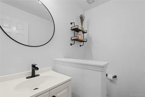 a bathroom with a sink and mirror