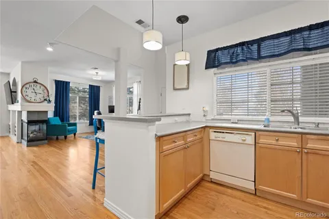 a kitchen with sink cabinets and window