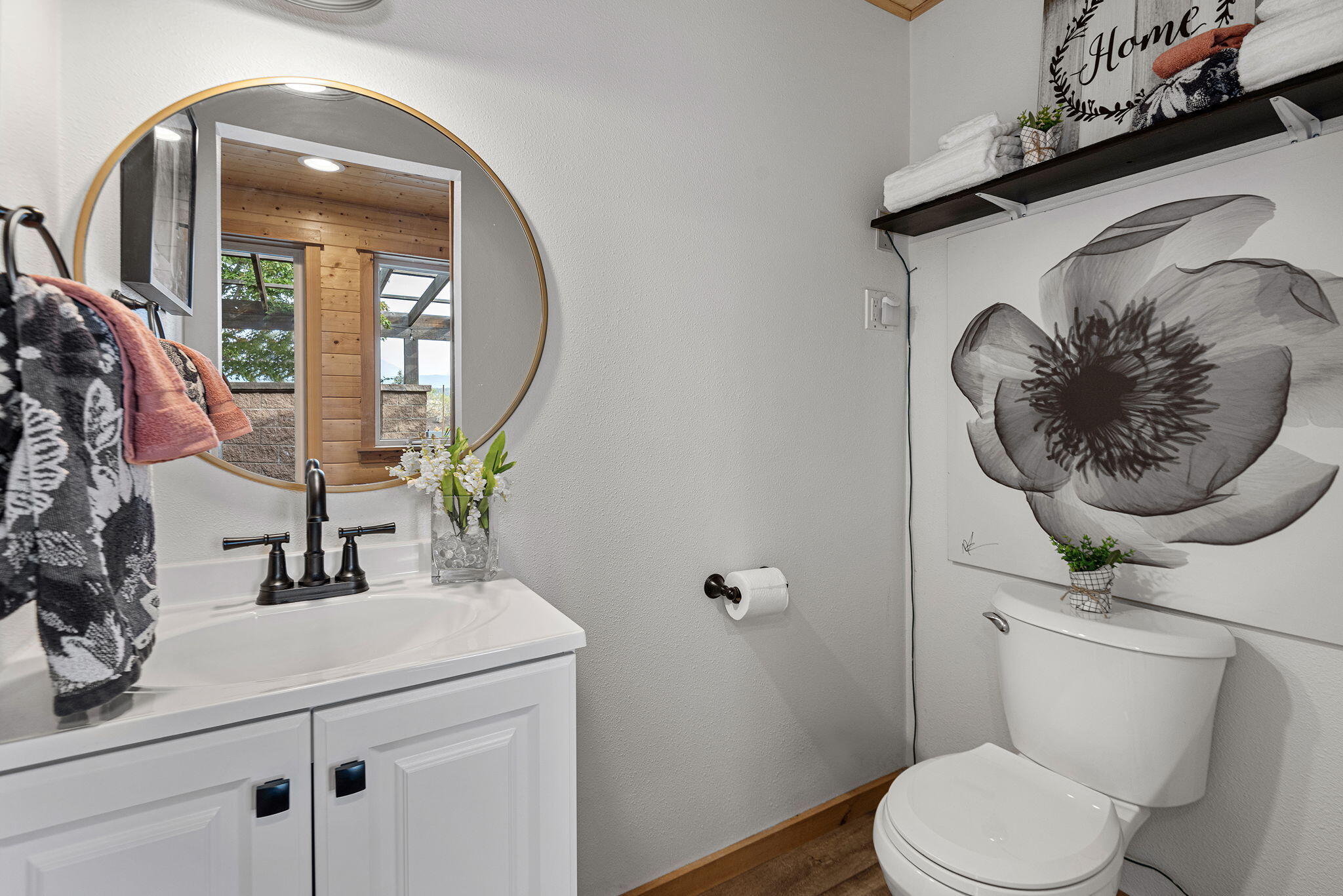 66901 Lance Road Bend, OR 97703 - Photo 26 of 71 a bathroom with a toilet sink vanity and mirror