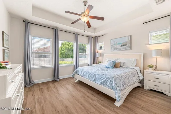 a bedroom with a large bed and a large window