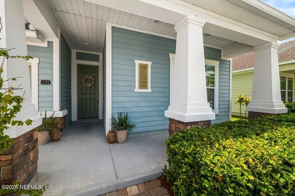 a front view of a house with chairs