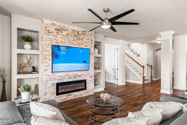 a living room with furniture and a fireplace