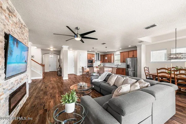 a living room with furniture and a flat screen tv