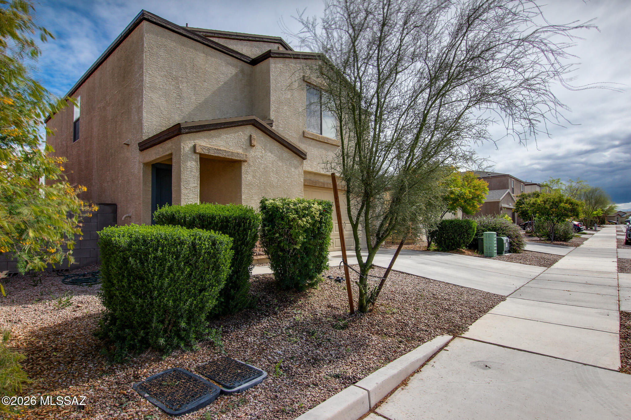 5987 South Antrim Loop Tucson, AZ 85706 - Photo 3 of 34 a view of a house with a street