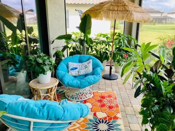 a outdoor living space with furniture and a potted plant