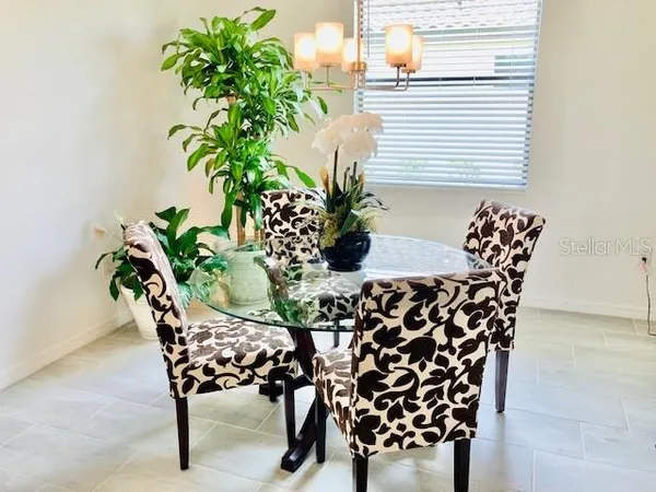 a patio with table and chairs