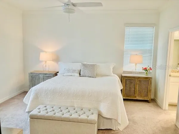 a bedroom with a bed and dresser