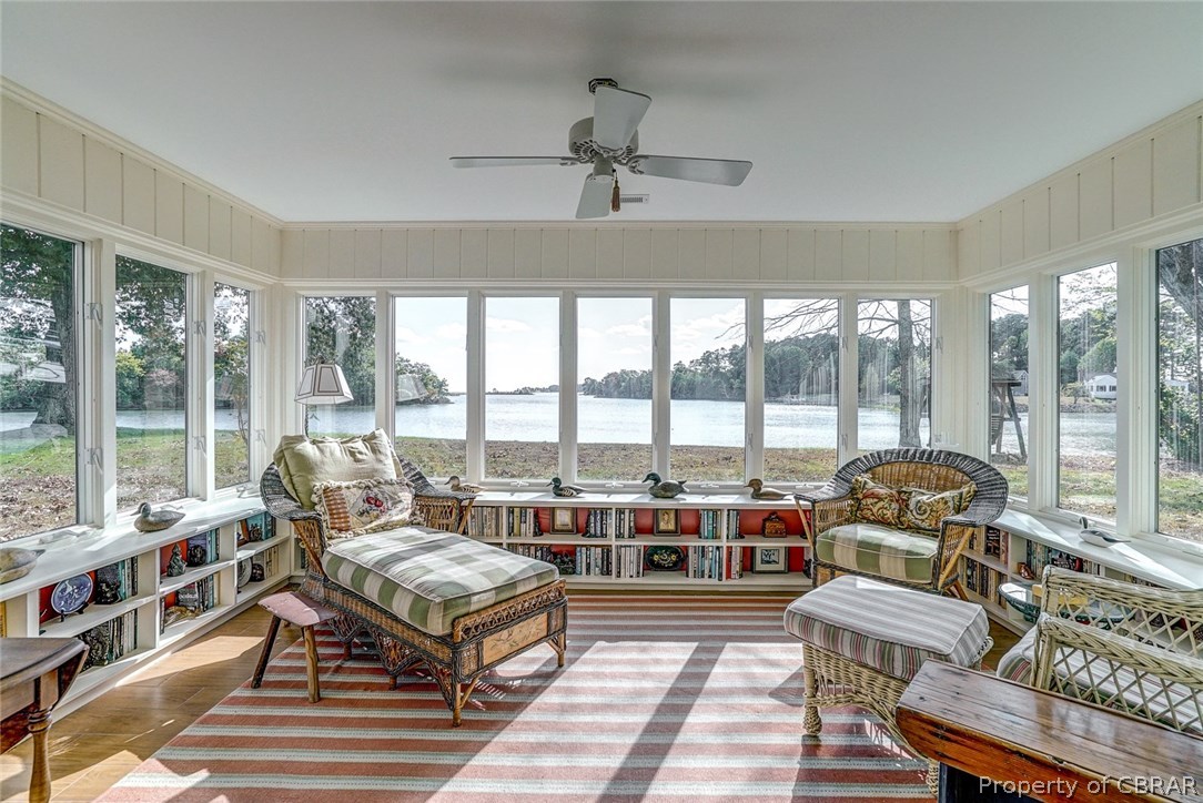 322 Lucom Point Drive Reedville, VA 22539 - Photo 17 of 28 Cozy sun room with walls of glass.