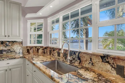 a kitchen with a sink and a window