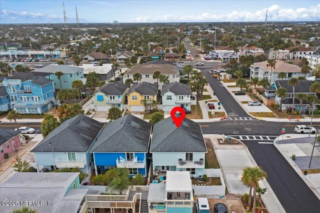 an aerial view of residential houses with outdoor space