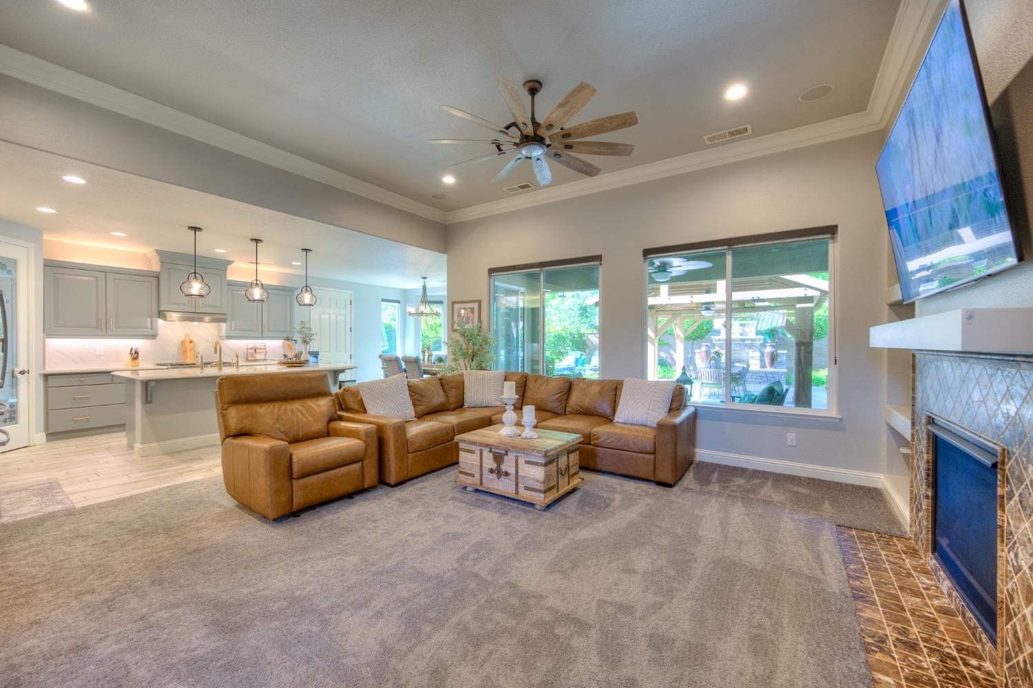3731 Serena Avenue Clovis, CA 93619 - Photo 11 of 54 a living room with fireplace furniture and a large window