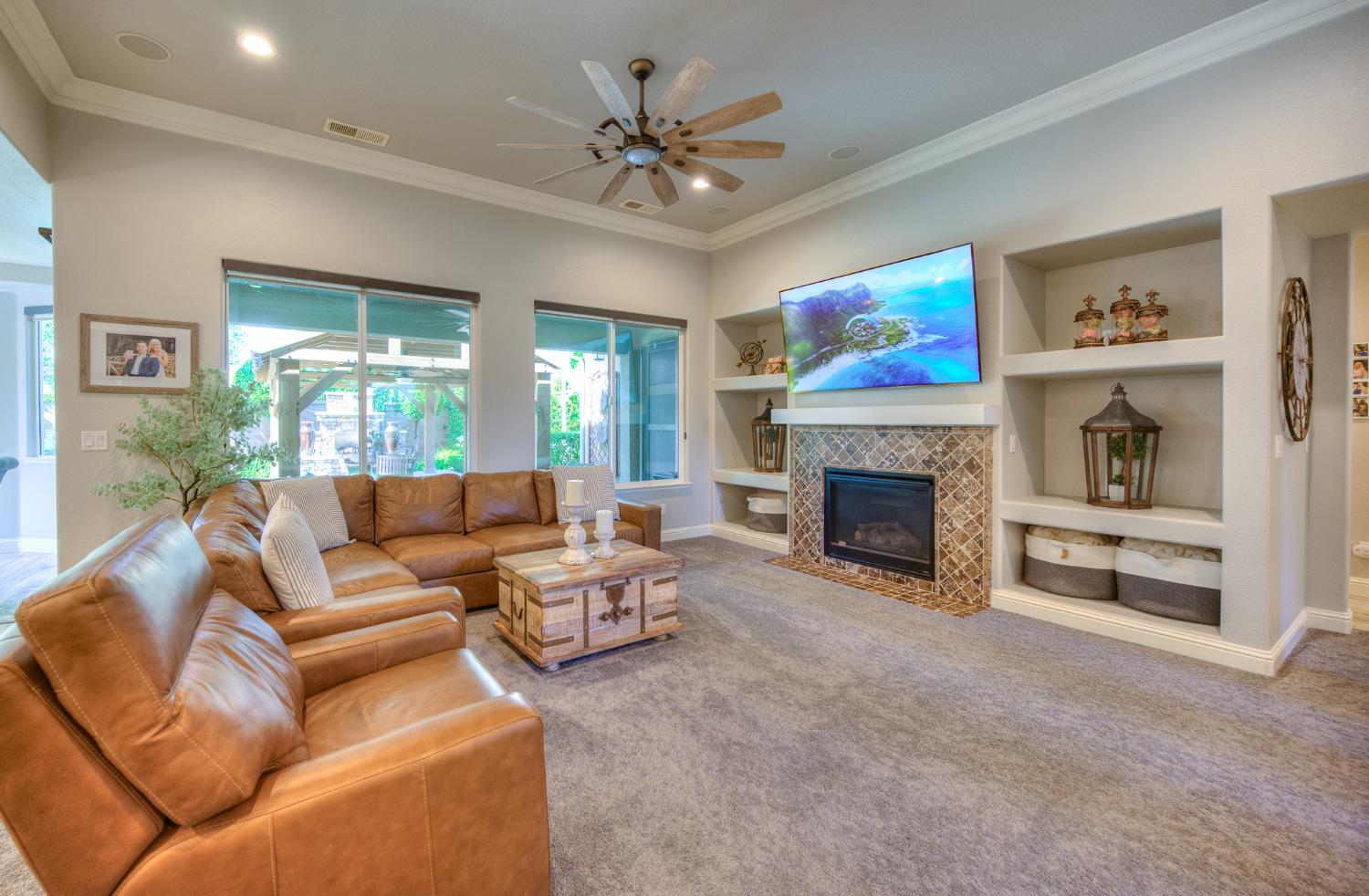 3731 Serena Avenue Clovis, CA 93619 - Photo 12 of 54 a living room with furniture and a fireplace