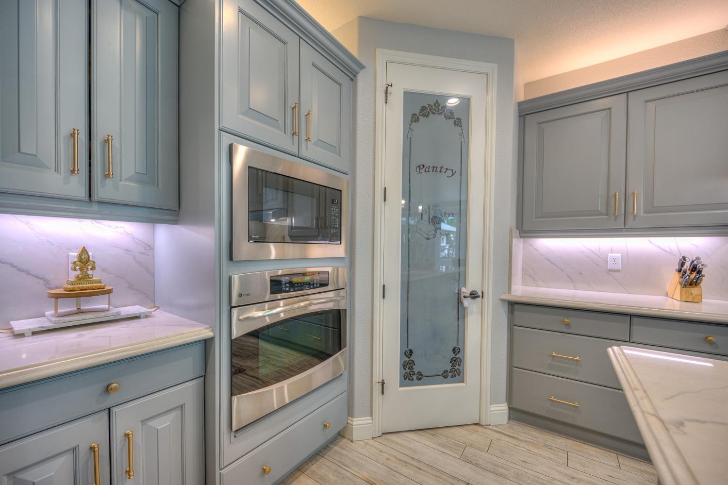 3731 Serena Avenue Clovis, CA 93619 - Photo 16 of 54 a kitchen with granite countertop a sink stainless steel appliances and cabinets