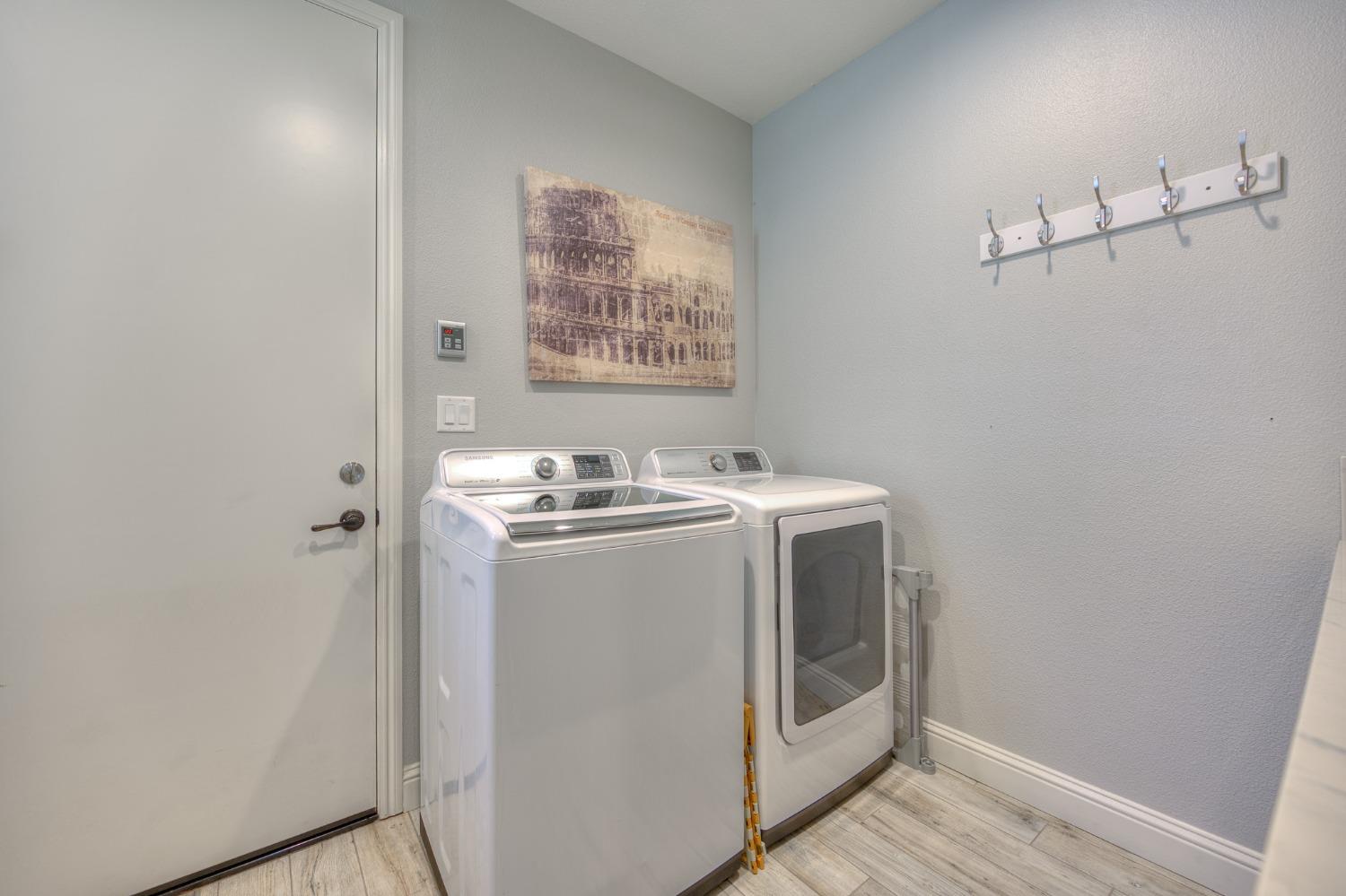 3731 Serena Avenue Clovis, CA 93619 - Photo 22 of 54 a utility room with dryer and washer