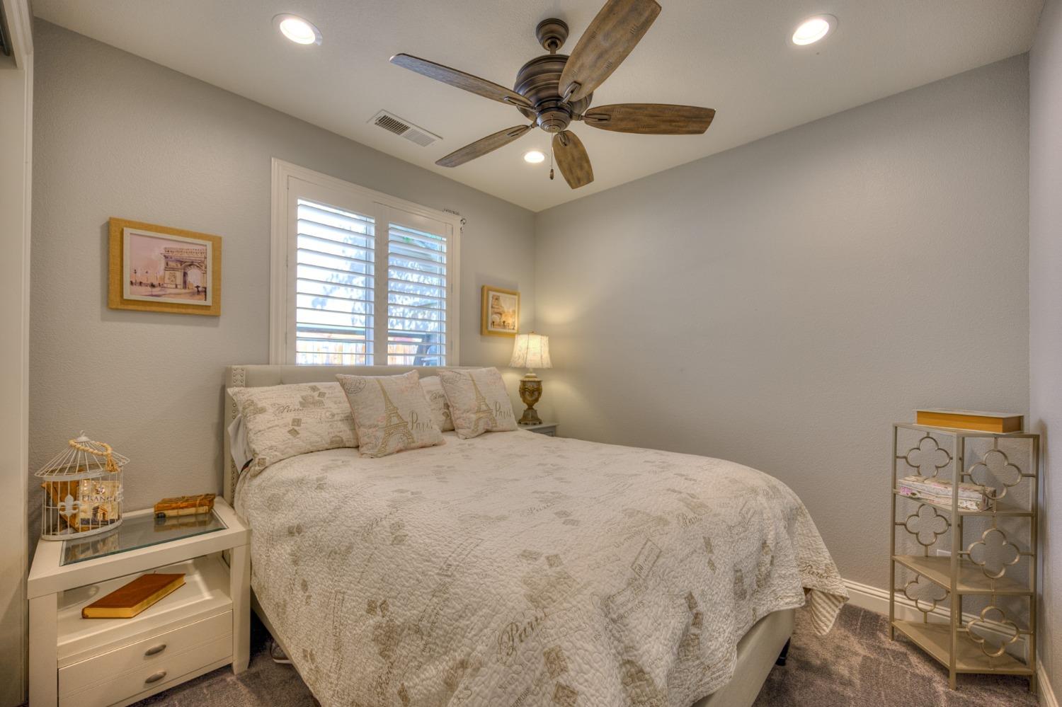 3731 Serena Avenue Clovis, CA 93619 - Photo 27 of 54 a bedroom with a bed and a window