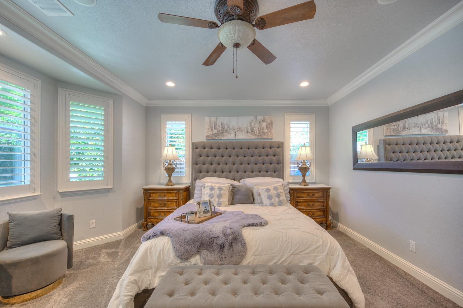 3731 Serena Avenue Clovis, CA 93619 - Photo 31 of 54 a bedroom with a large bed and a couch
