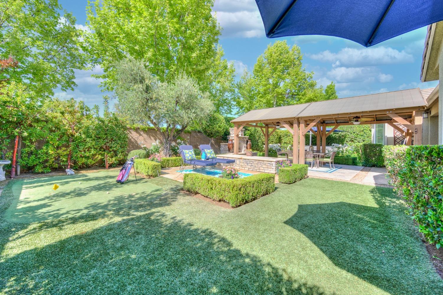 3731 Serena Avenue Clovis, CA 93619 - Photo 35 of 54 a view of a backyard with a garden and plants