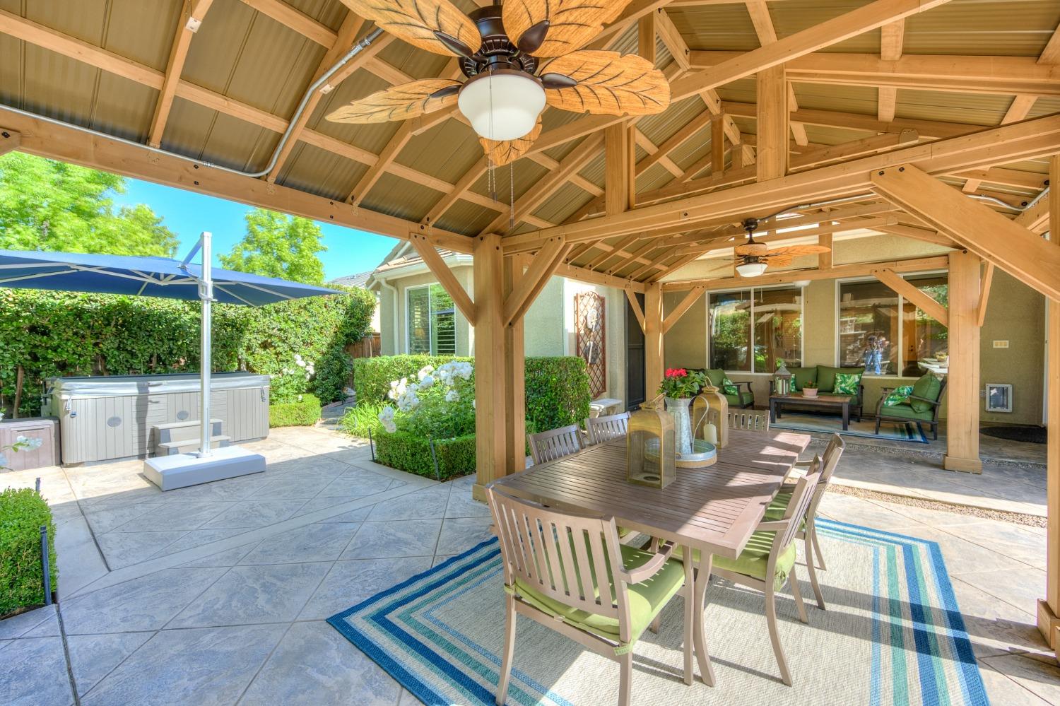 3731 Serena Avenue Clovis, CA 93619 - Photo 41 of 54 a patio with yard glass top table and chairs