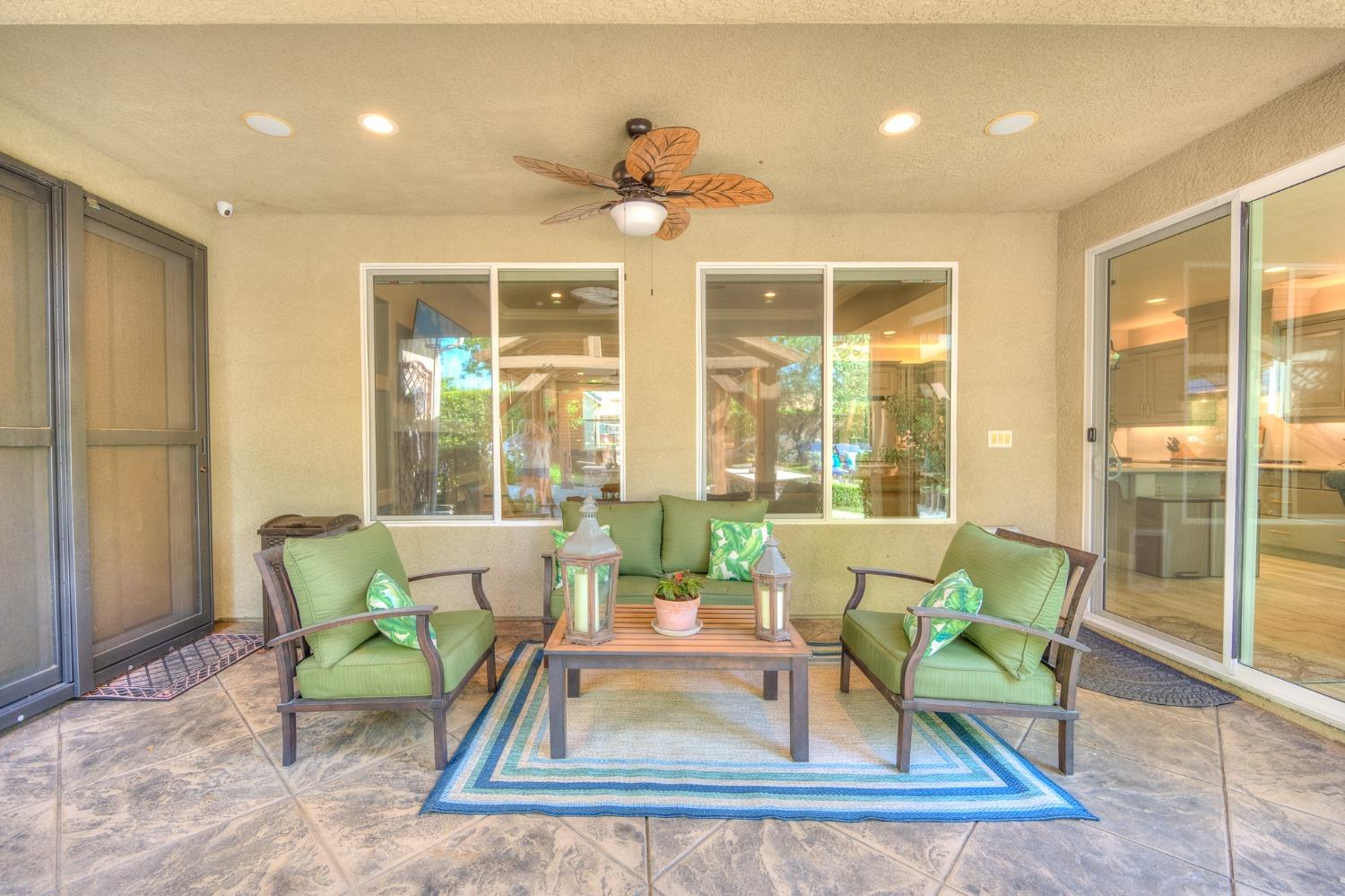 3731 Serena Avenue Clovis, CA 93619 - Photo 43 of 54 a dining room with wooden floor and a chandelier