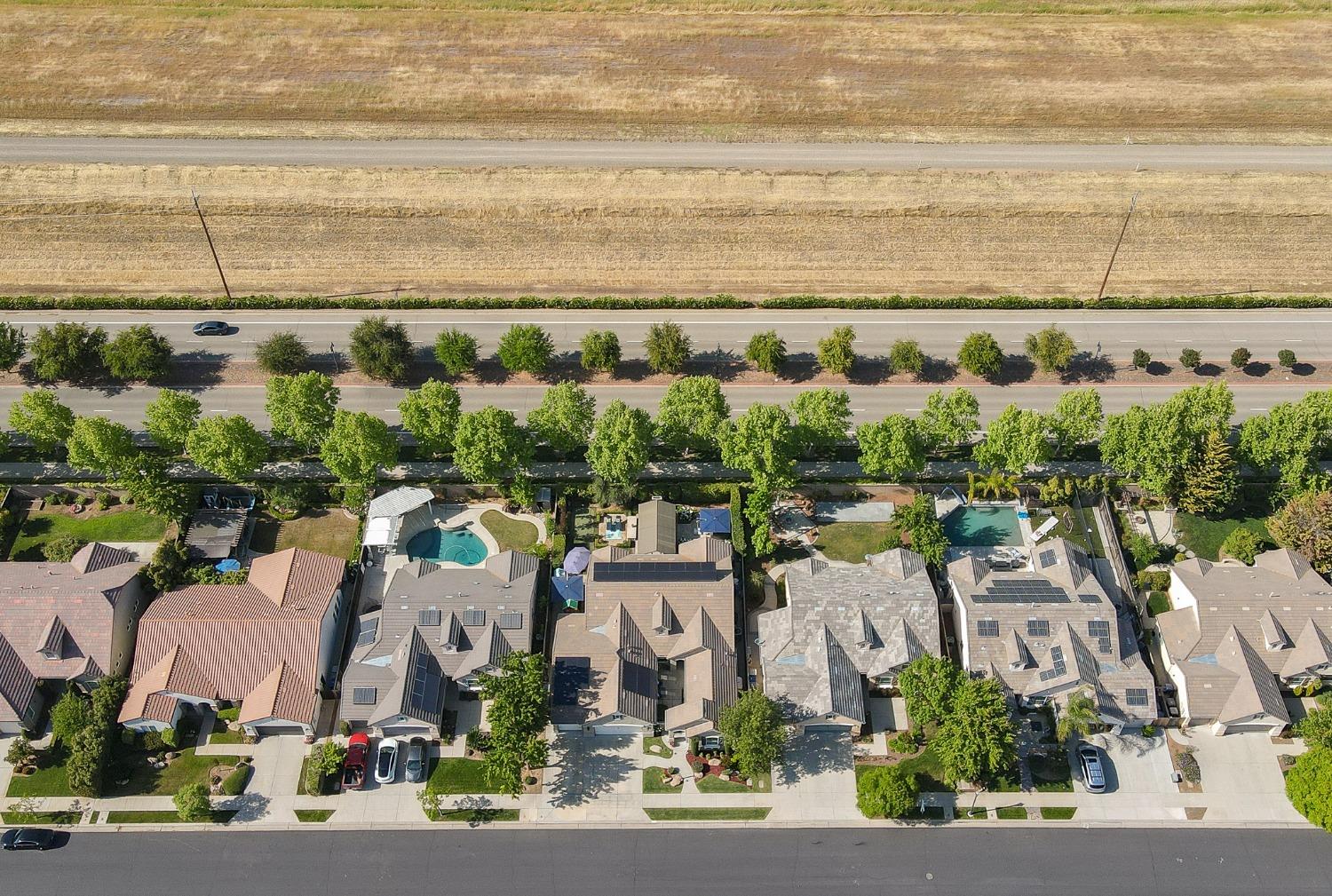 3731 Serena Avenue Clovis, CA 93619 - Photo 48 of 54 an aerial view of a city with lots of residential buildings ocean and mountain view in back