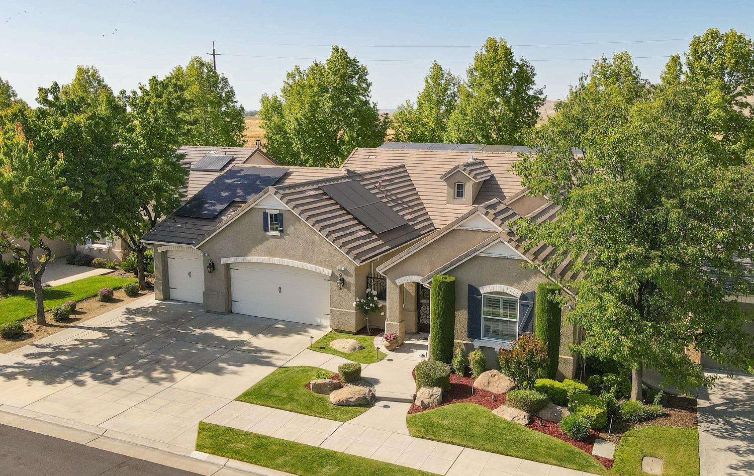 3731 Serena Avenue Clovis, CA 93619 - Photo 51 of 54 a front view of a house with garden