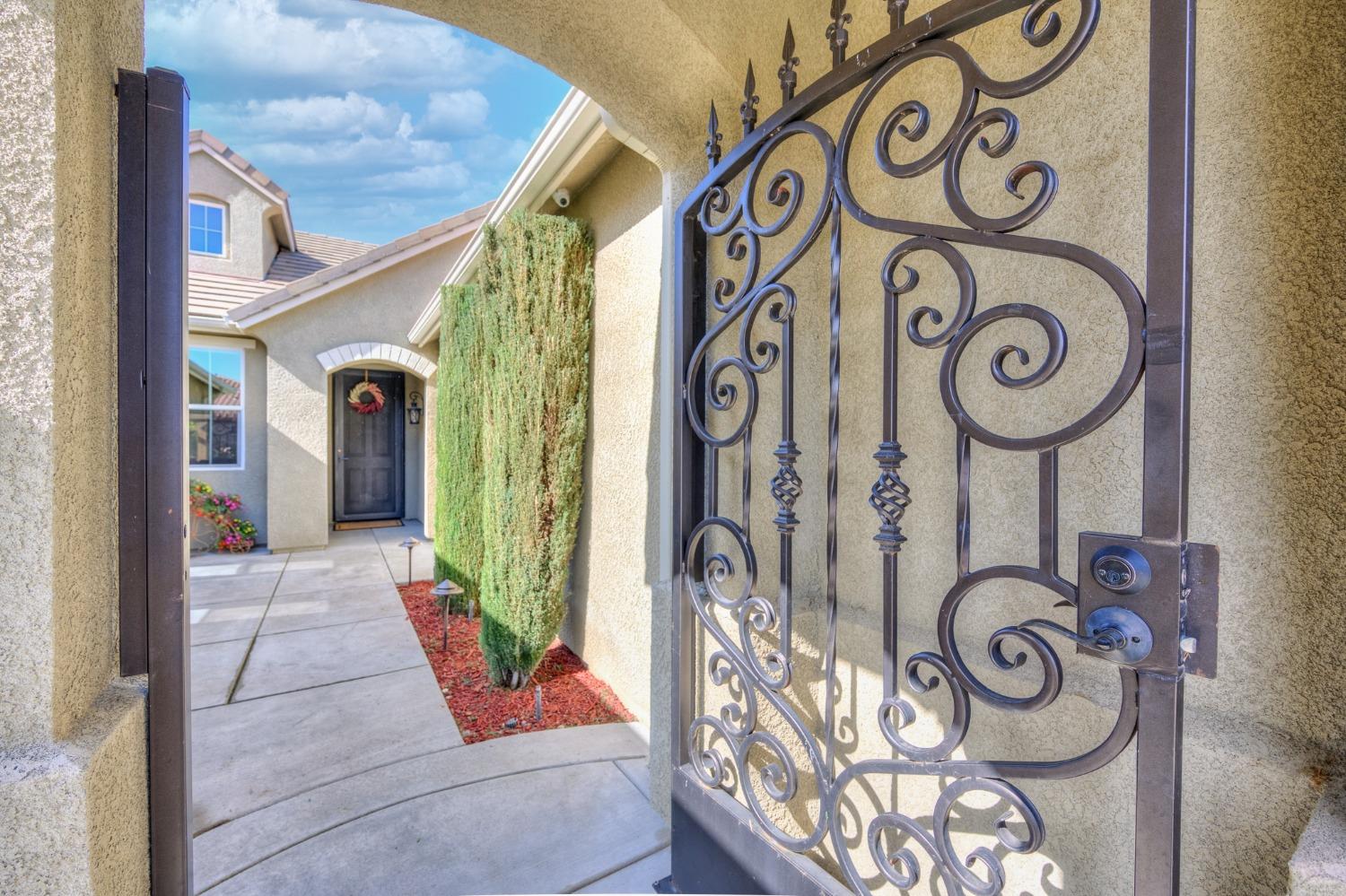 3731 Serena Avenue Clovis, CA 93619 - Photo 7 of 54 a view of a door and car parked on the wall