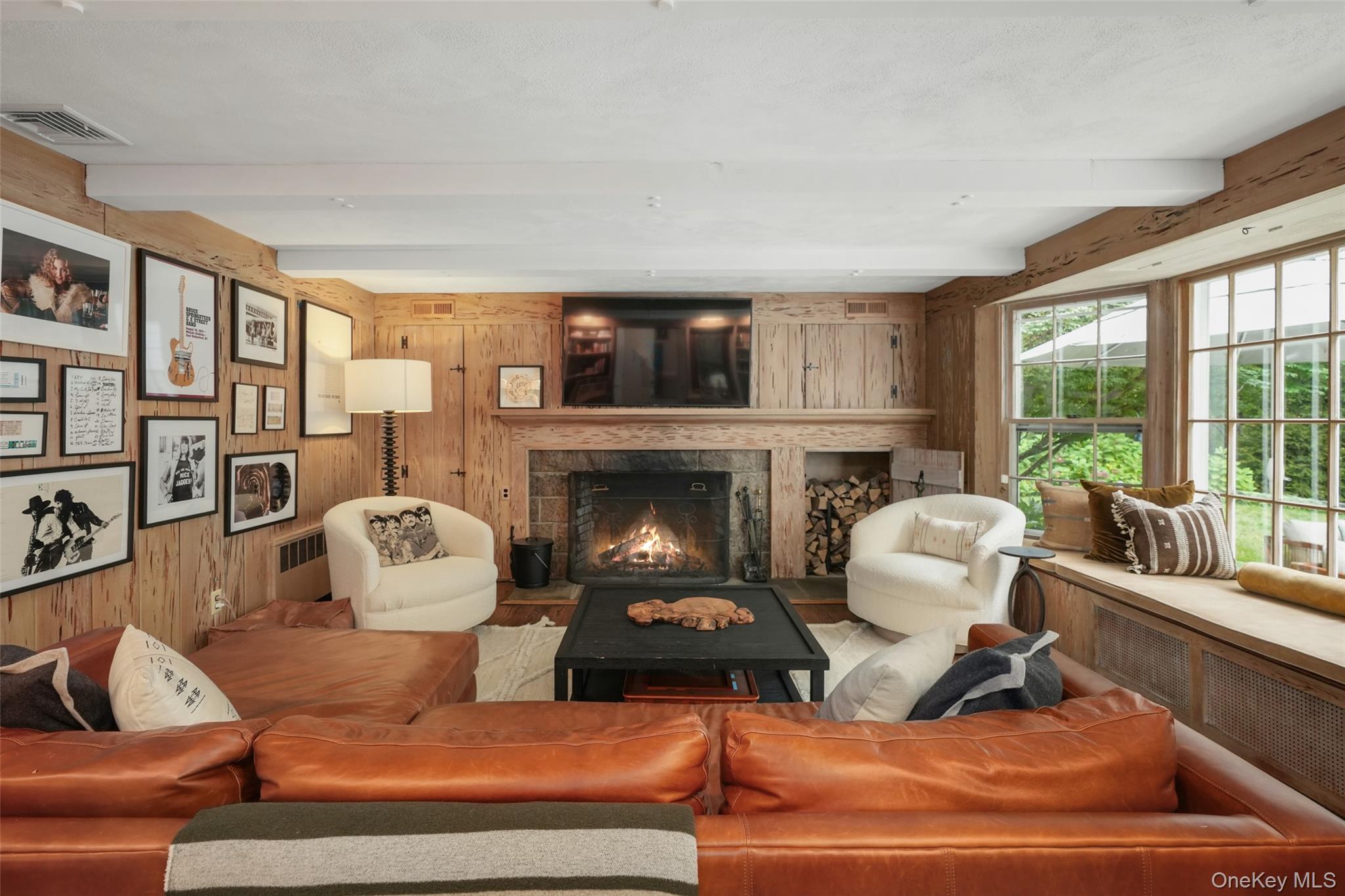 43 Croton Lake Road Katonah, NY 10536 - Photo 11 of 26 a living room with furniture and a fireplace