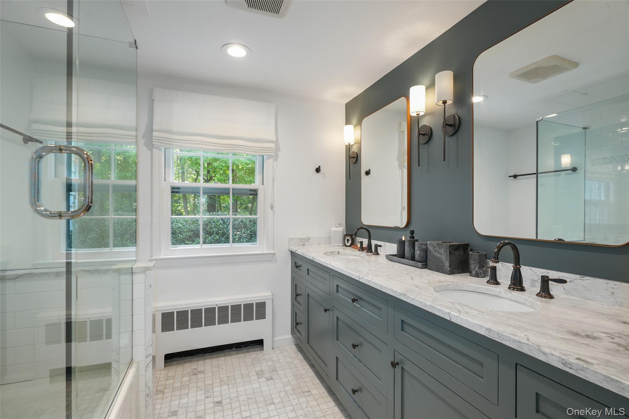 43 Croton Lake Road Katonah, NY 10536 - Photo 13 of 26 a bathroom with double vanity and a mirror