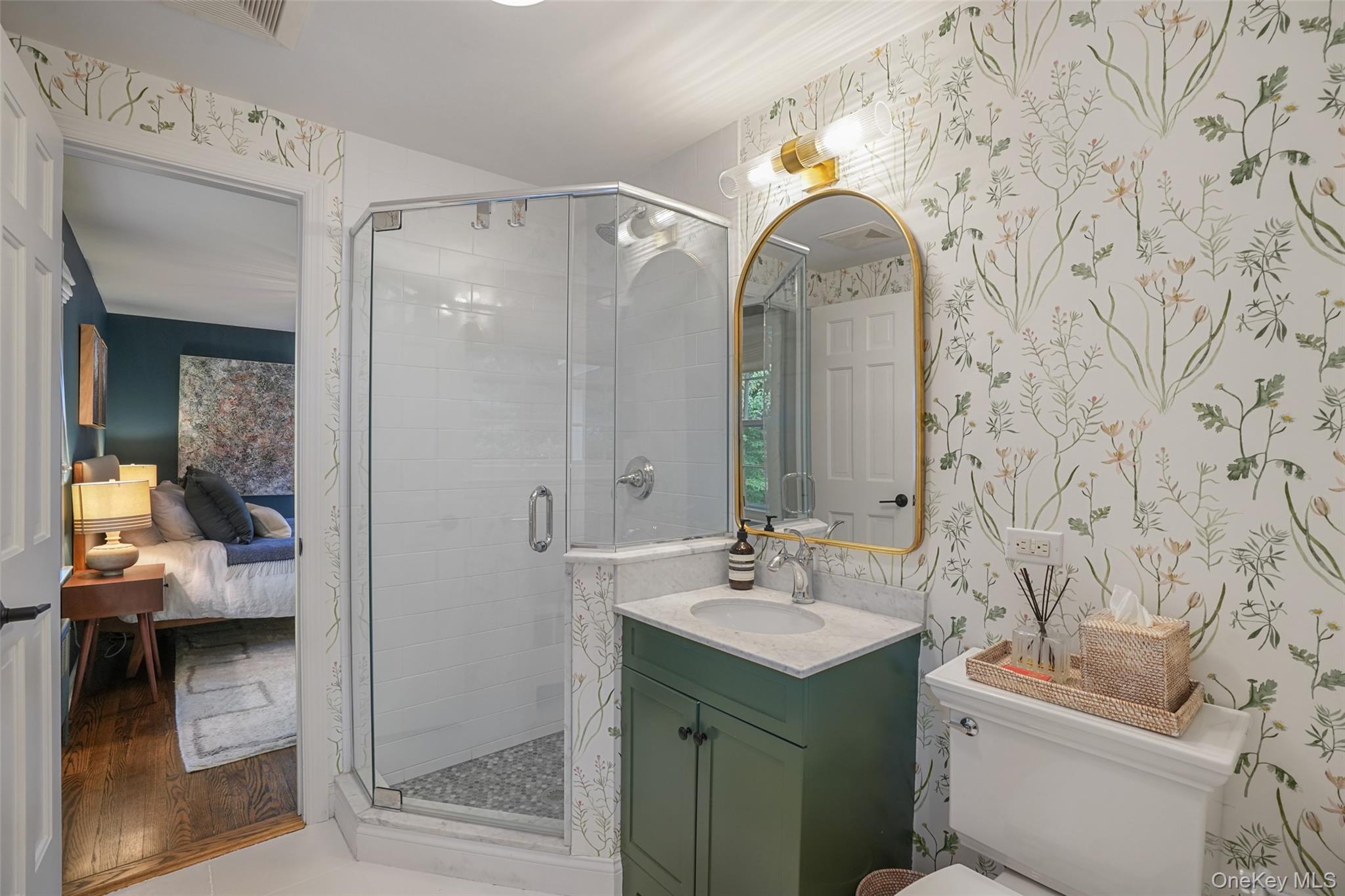 43 Croton Lake Road Katonah, NY 10536 - Photo 19 of 26 a bathroom with a sink a toilet and shower