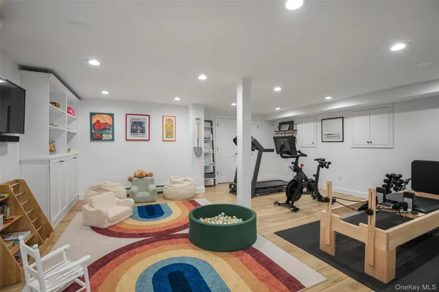 a room with furniture a flat screen tv and a view of living room