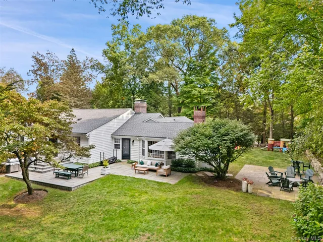 a aerial view of a house with swimming pool garden and patio
